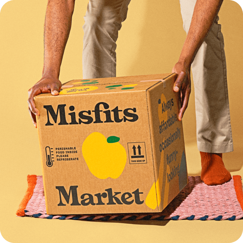 Person picking up a Misfits Market box