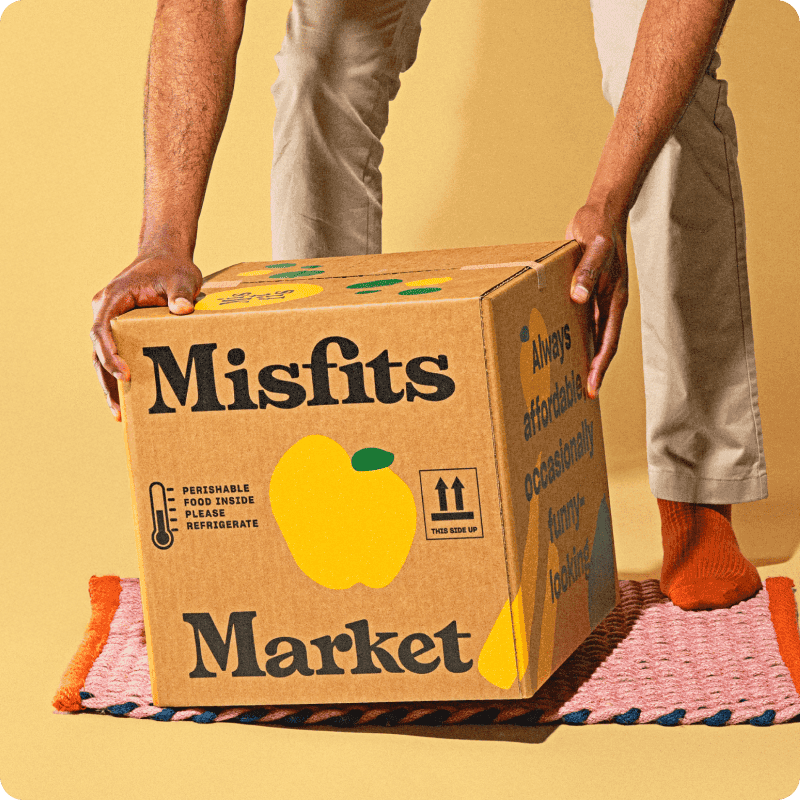 Person picking up a Misfits Market box