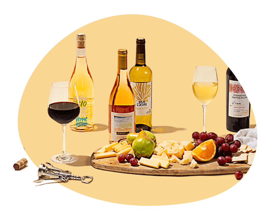 Assortment of wine bottles, glasses, and a charcuterie board