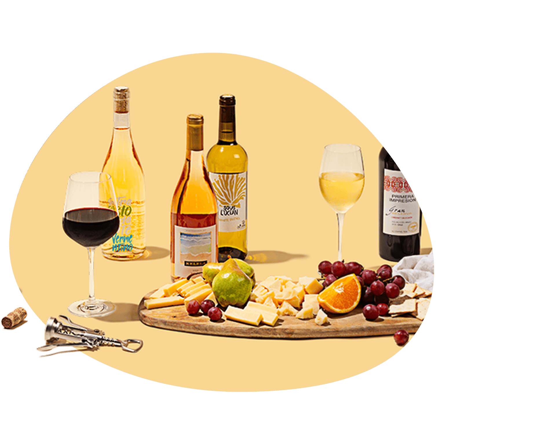 Assortment of wine bottles, glasses, and a charcuterie board