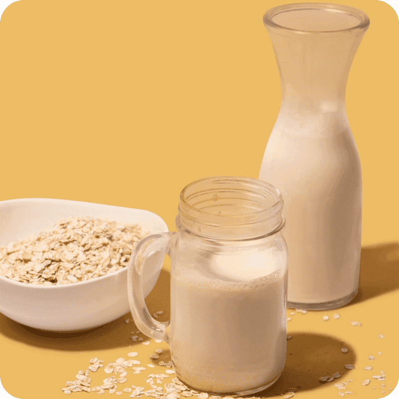 Milk next to a bowl of cereal