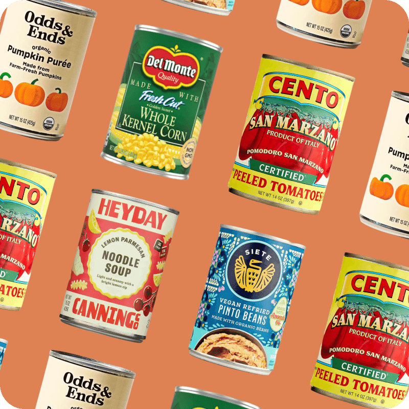 Canned goods delivery variety with Cento tomatoes, Del Monte corn, Heyday noodle soup, Siete pinto beans, and pumpkin purée.