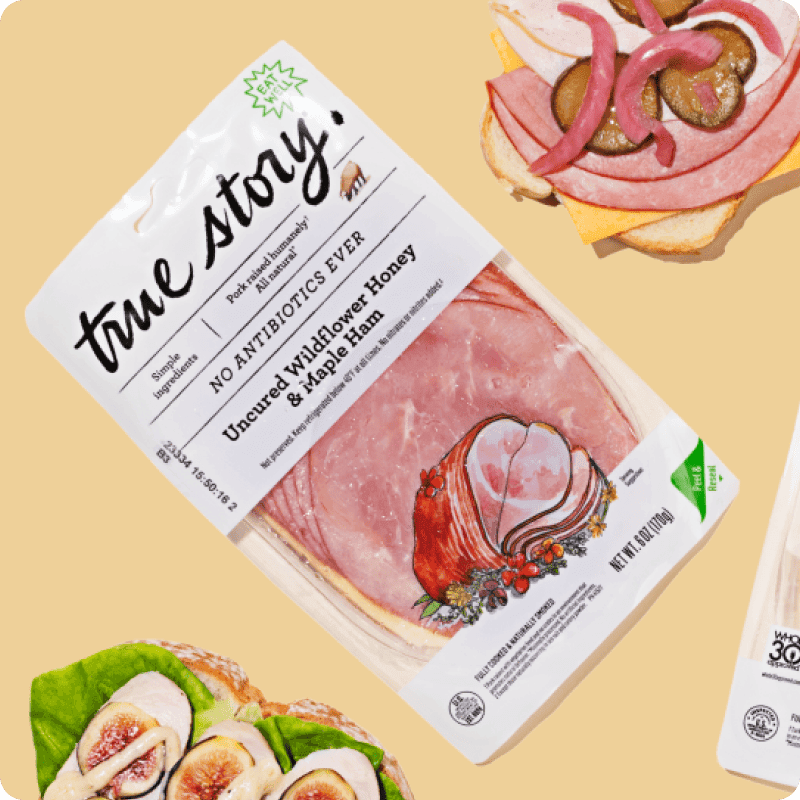 True Story Uncured Wildflower Honey & Maple sliced ham delivery package with no antibiotics ever, shown with sandwich and fig salad.